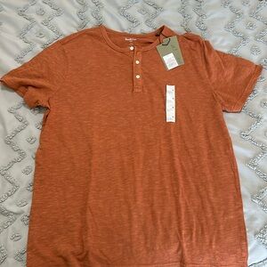 Men’s orange button tee shirt